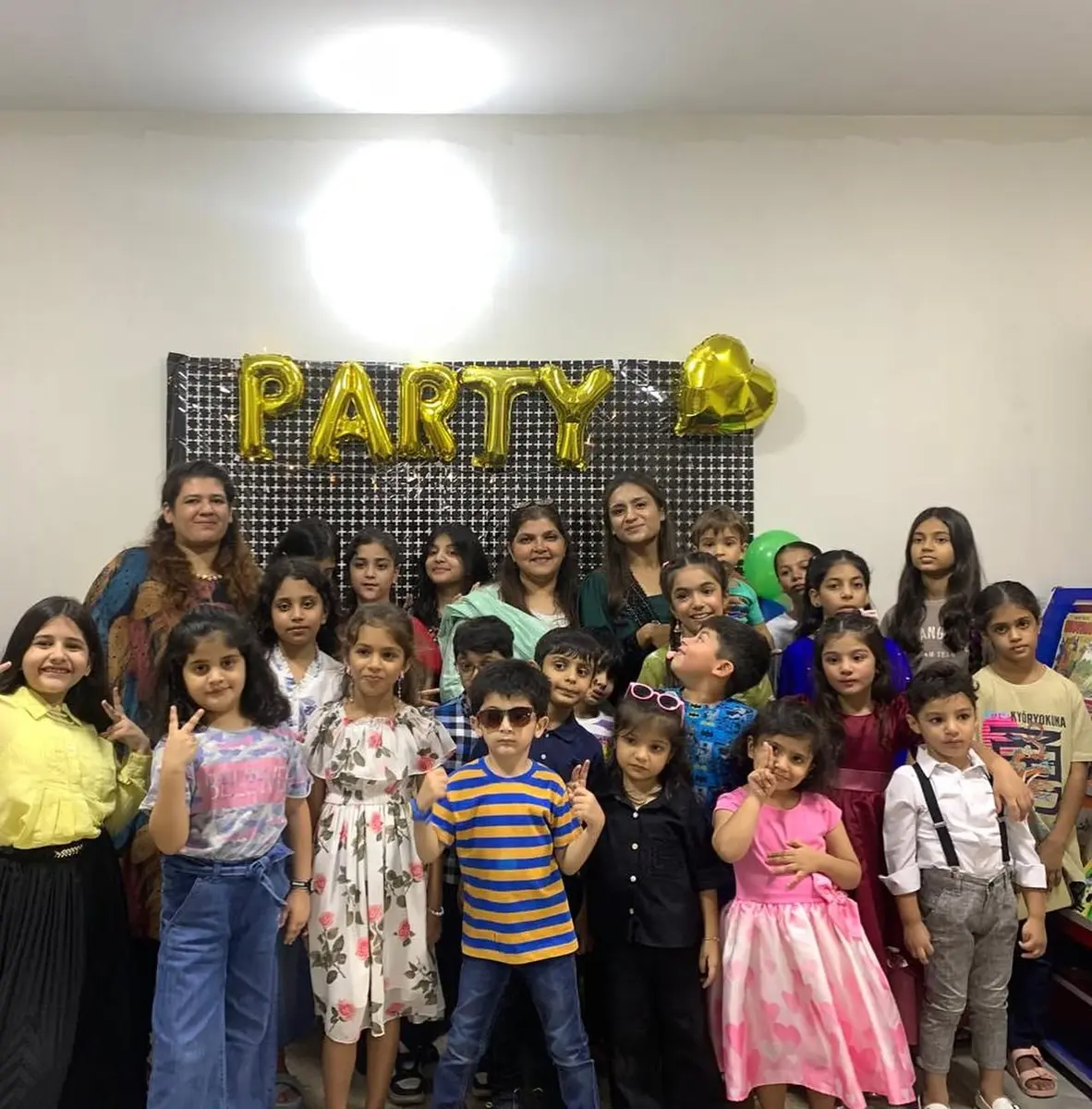 Students and teachers celebrating together at a class party