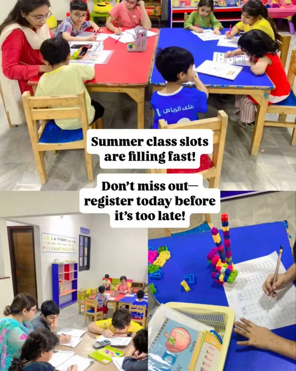 Students working in small groups at desks during a tutoring session