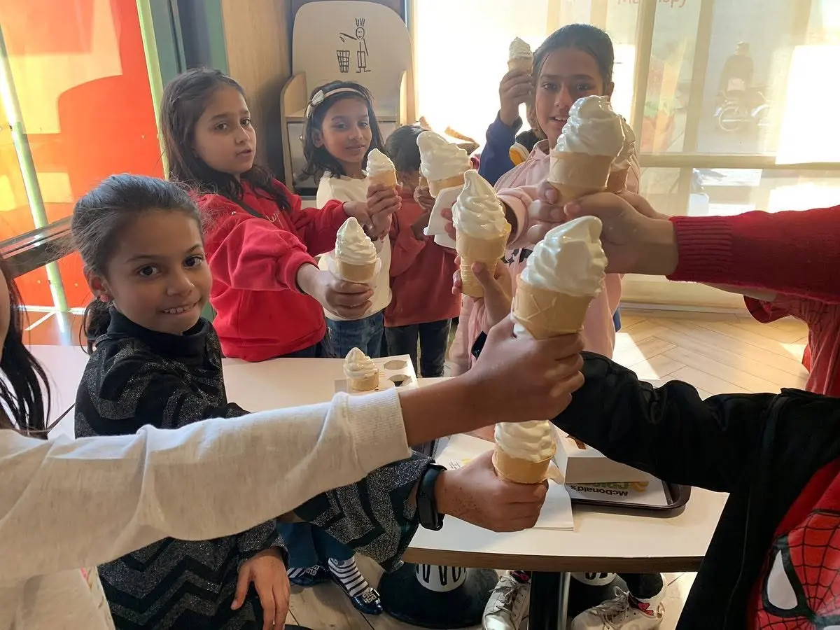 Students enjoying an ice cream treat during a class outing