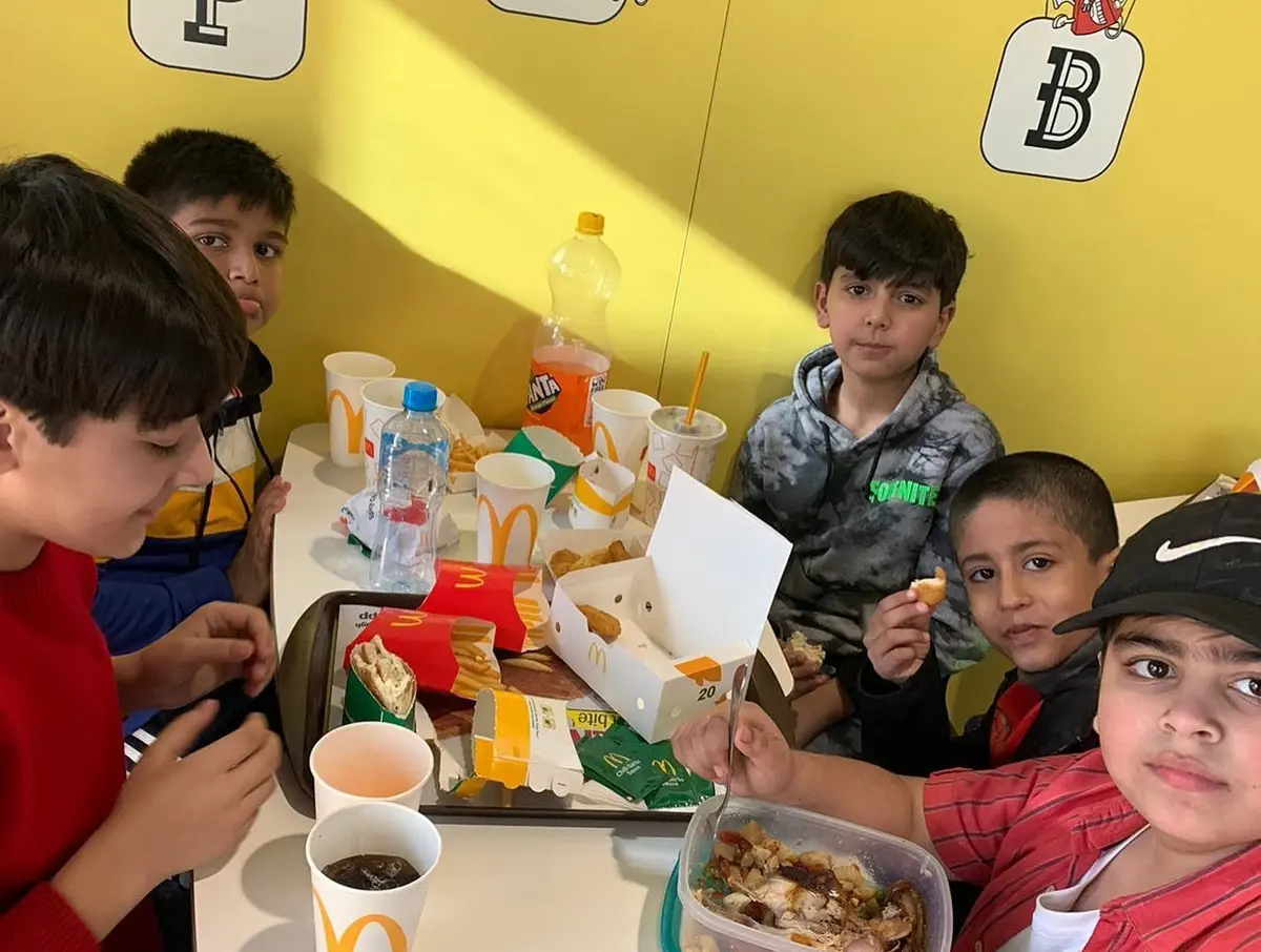 Students sharing a snack break together between lessons